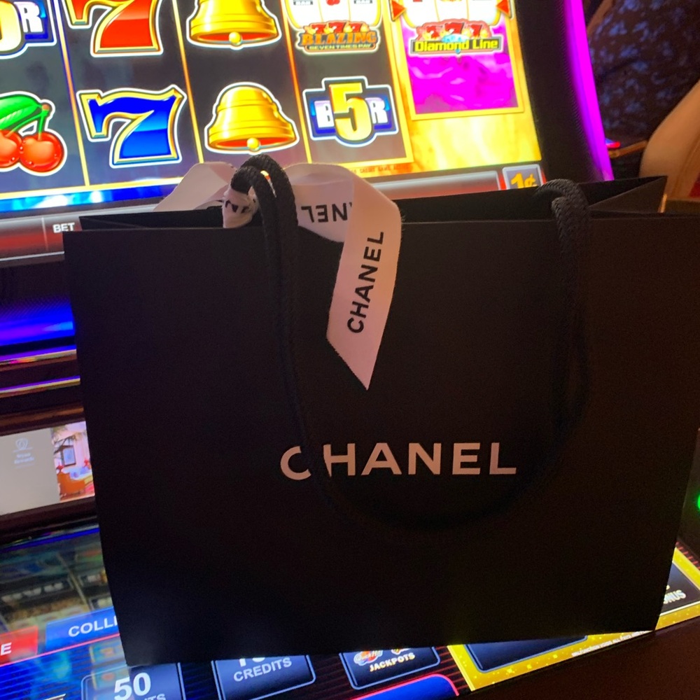 Brand new authentic Chanel shopping bag with bow . Must have for collectors !